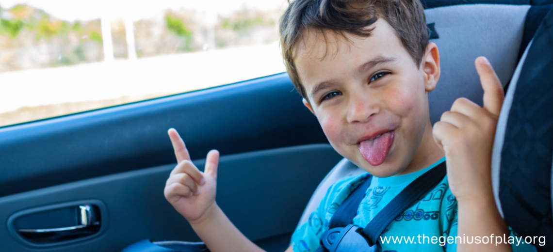 Boy making silly face in car trip