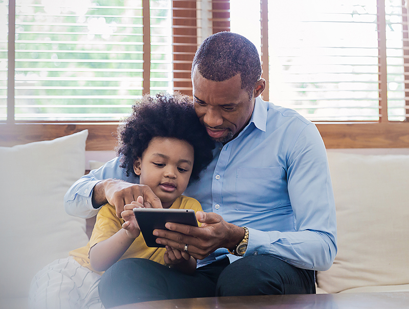 child-with-adult-on-ipad