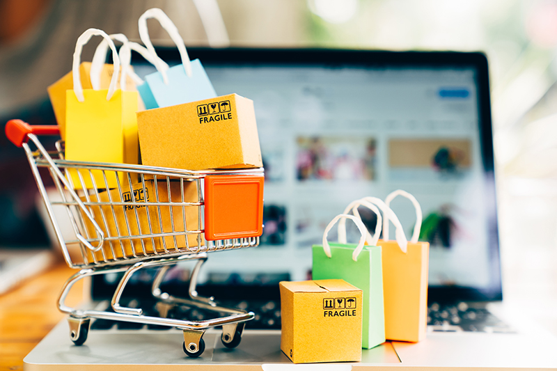 stock image of boxes in shopping cart