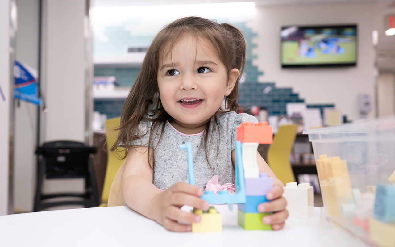 patient at children's hospital playing with a toy